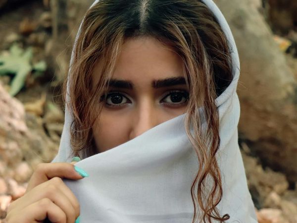 Person looking into the far green forest to relax eyes